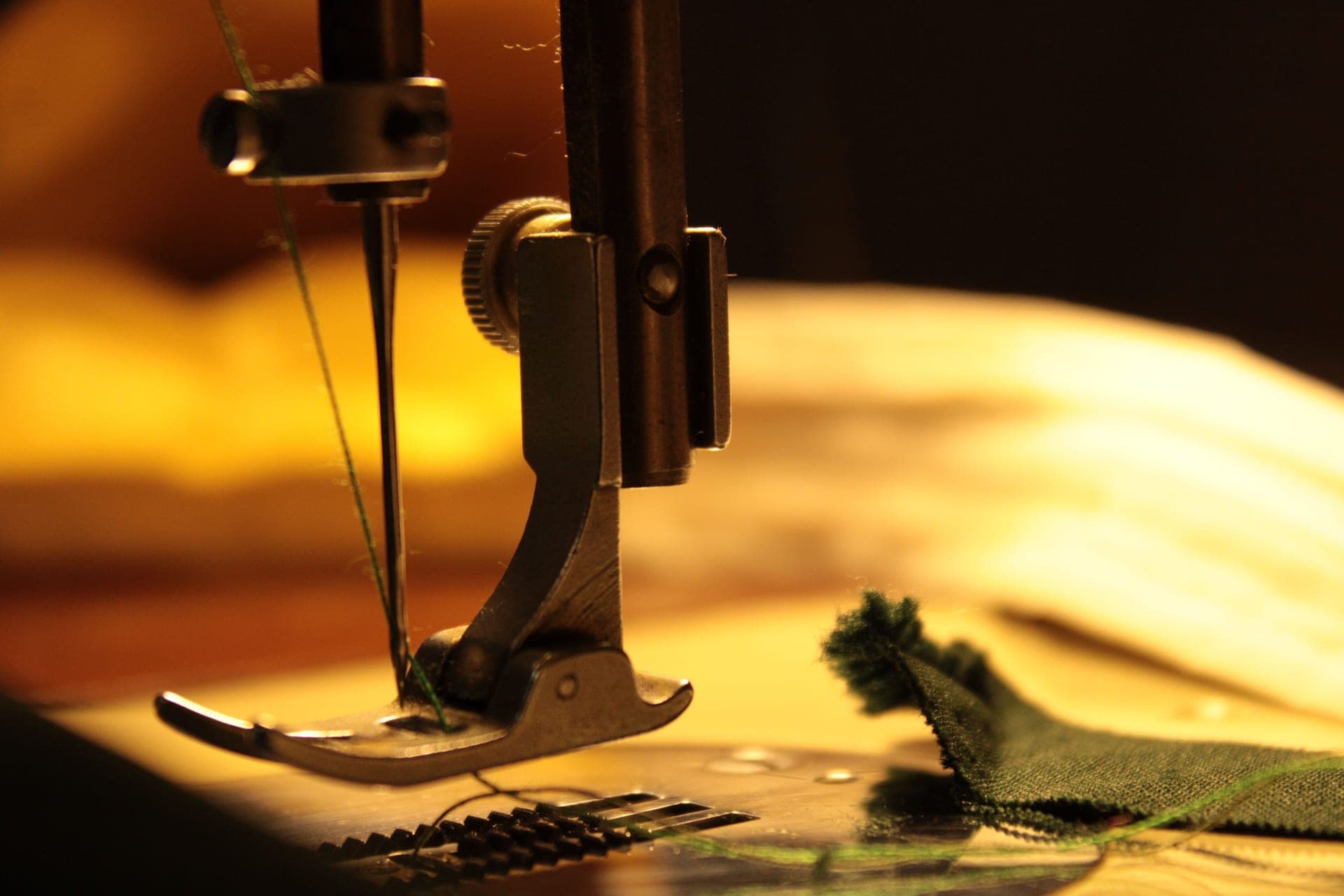 A sewing machine needle stitching through fabric - a stand-in for the Juki TL-2010Q, not a photograph of this model
