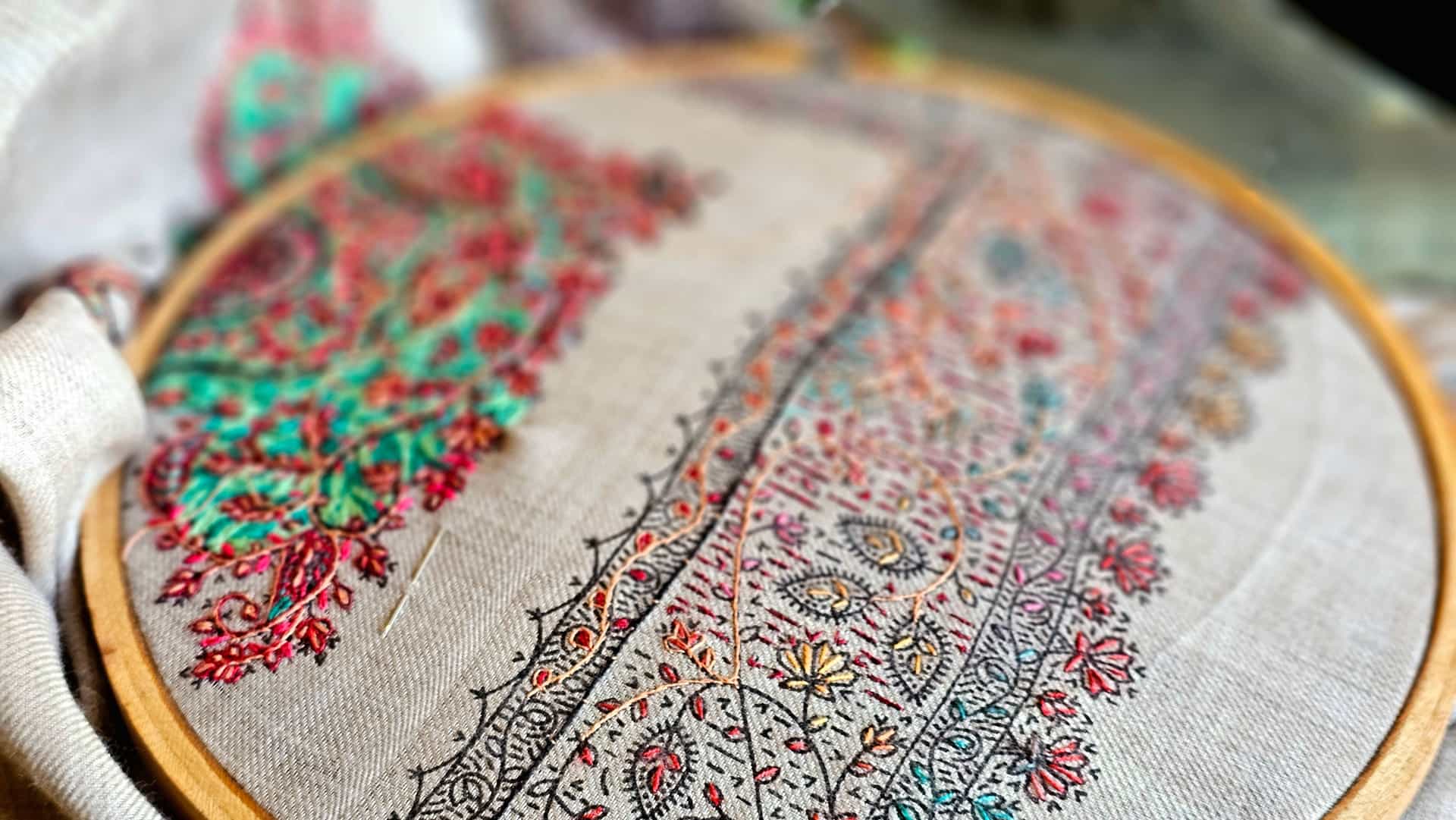 Hand embroidery stitched into fabric held in a hoop