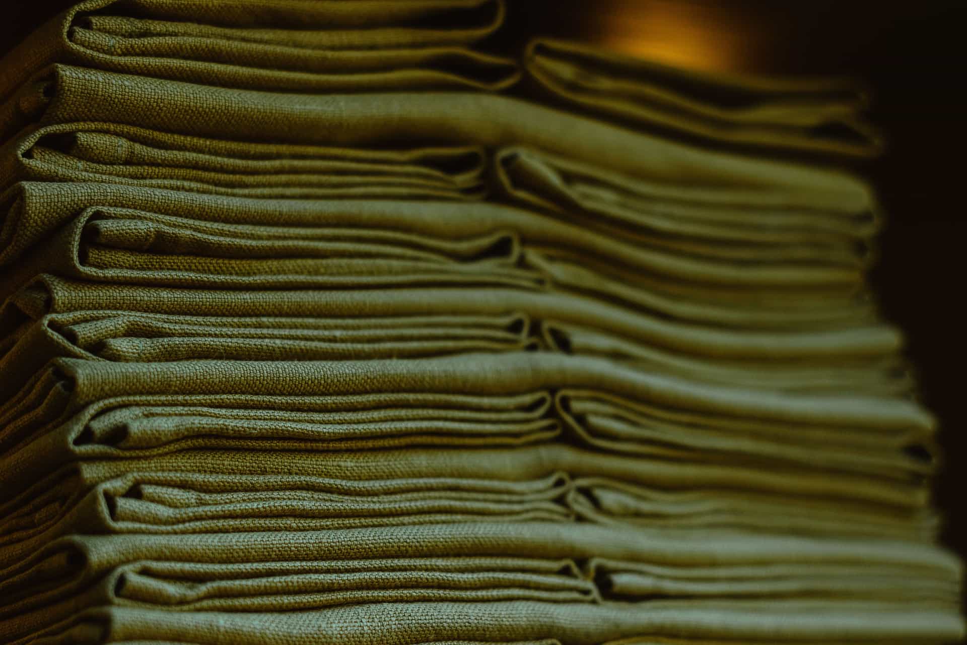 A stack of neatly folded fabric photographed close up